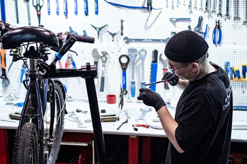 Mechanic working on a bike in a workshop